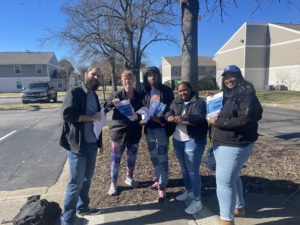 2022 Housing Justice Program Fellows DeAnna B. Smith and Jamesa D. Parker stand with community members in Virginia