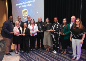 Photo of award recipients of the 2023 National VOAD awards standing with their plaques at the award ceremony.