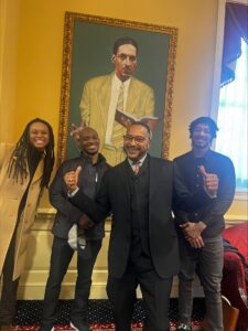 Photo of DiNesha (left) with Senator Muse of Maryland and two team members.