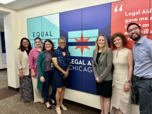 Photo (L-R) of: Leeja Patel, Barbara Bertini, Teresa Sullivan, Verna Williams, Katherine Shank, Kristen Uhler-McKeown, Richard Luong at Legal Aid Chicago's offices