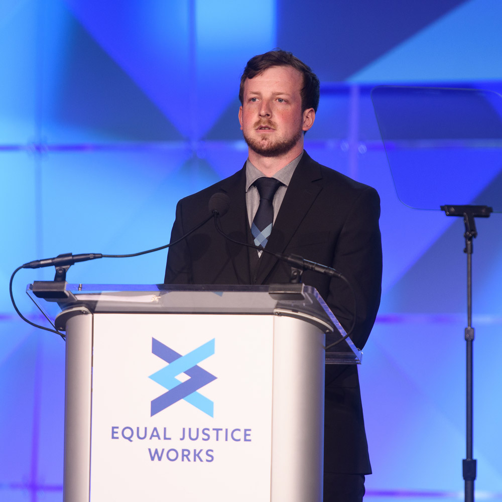 Equal Justice Works Fellow Brendan Wood shares his work on the stage at the 2019 Annual Dinner