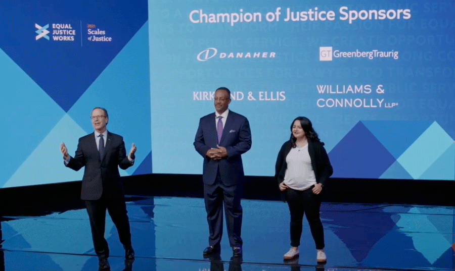 Photo of David Stern, Brian Ellis, and Fernanda Herrera Spieler on stagge at Scales of Justice