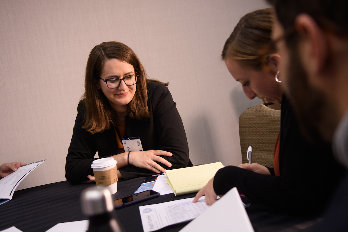 Photo of a student speaking with career counselors.
