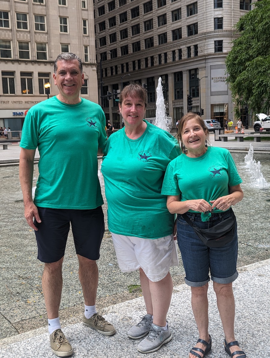 Amy Perry standing between two of her coworkers from Equip for Equality
