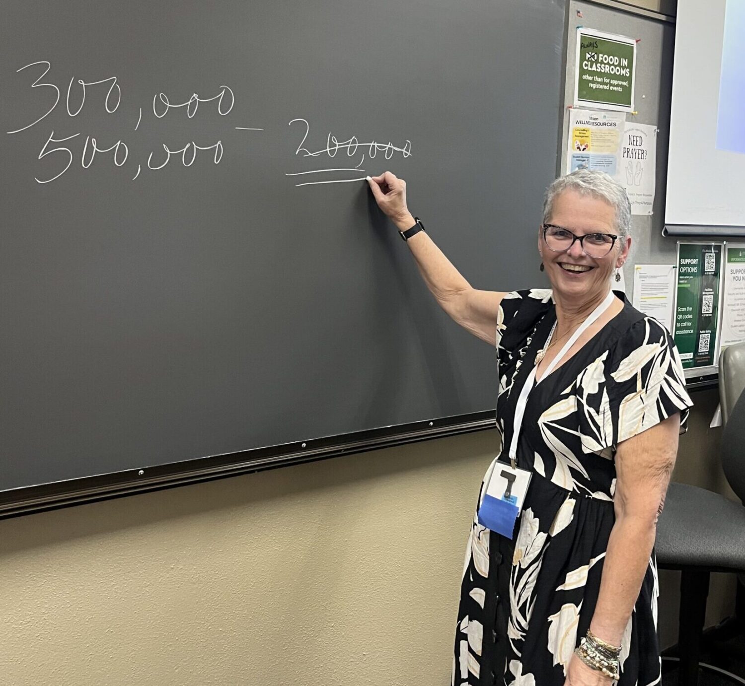 Photo of Sherry Peterson at a white board during her breakout session at the disaster resilience symposium
