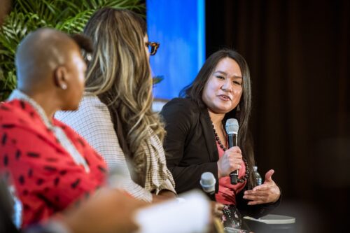 Photo of Kace Rodwell speaking on the opening plenary panel for 2025 Leadership Development Training