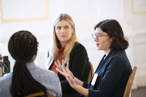 Photo of Fellows sitting and speaking at a breakout session at 2025 LDT