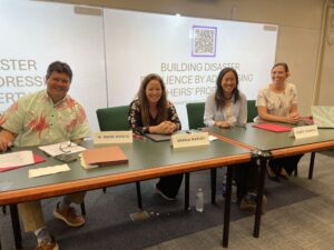 Sharla and Devon sit on an Heirs' property panel at the state access to justice commissionʻs annual conference.